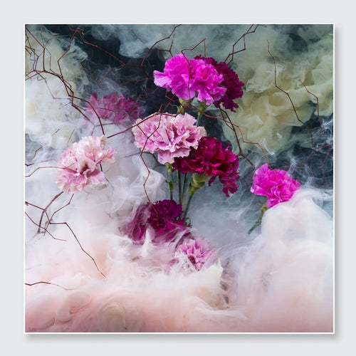A square art print or canvas featuring a stylized floral composition with pink, magenta, and white carnation-like flowers floating among swirling mist in soft blush, gray, and pale green tones.